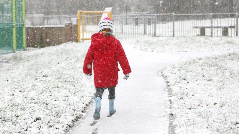 A child playing in the snow in Tunbridge Wells, Kent