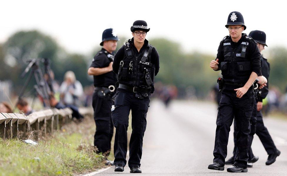 Police await the arrival of the cortege