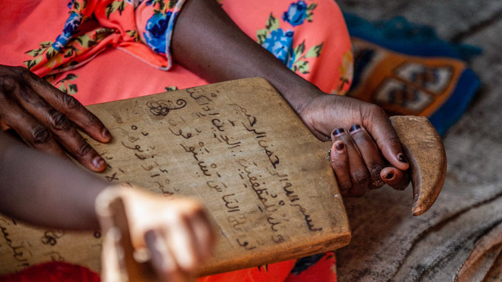 Pupils holding a school board at a Muslim school in the Central African Republic