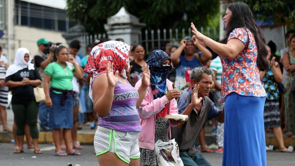 Relatives of inmates pray in front of Desembargador Raimundo Vidal Pessoa jail in the center of the Amazonian city of Manaus, Brazil, January 8, 2017.