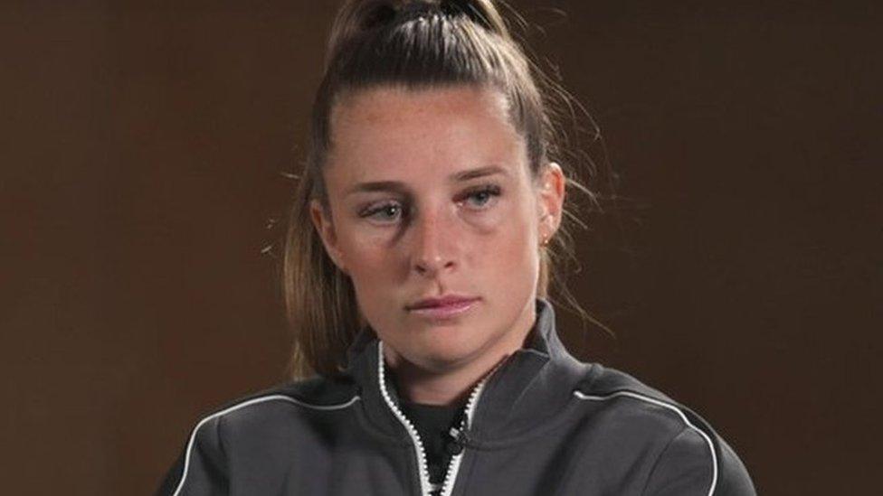 Ella Toone, dressed in sports gear, sitting in a chair about to be interviewed