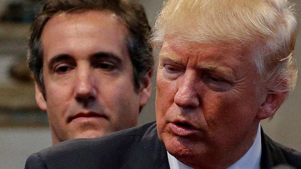 Michael Cohen stands behind Donald Trump, September 2016