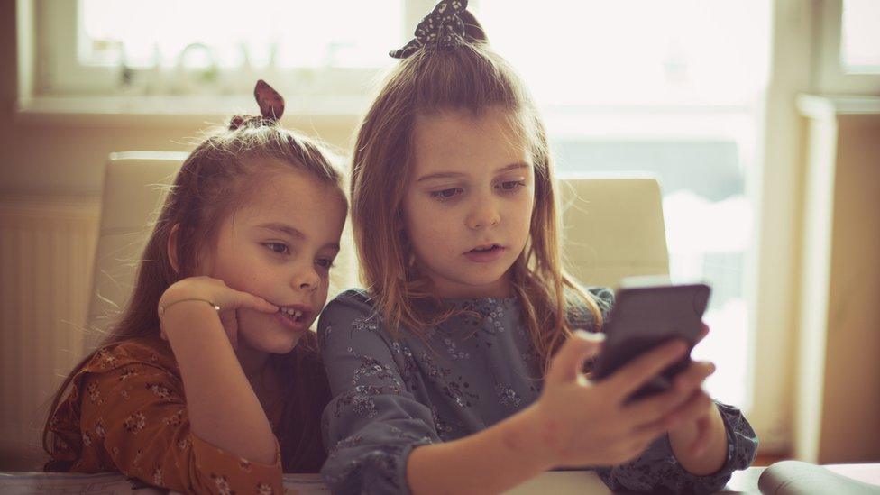 Girls looking at phone