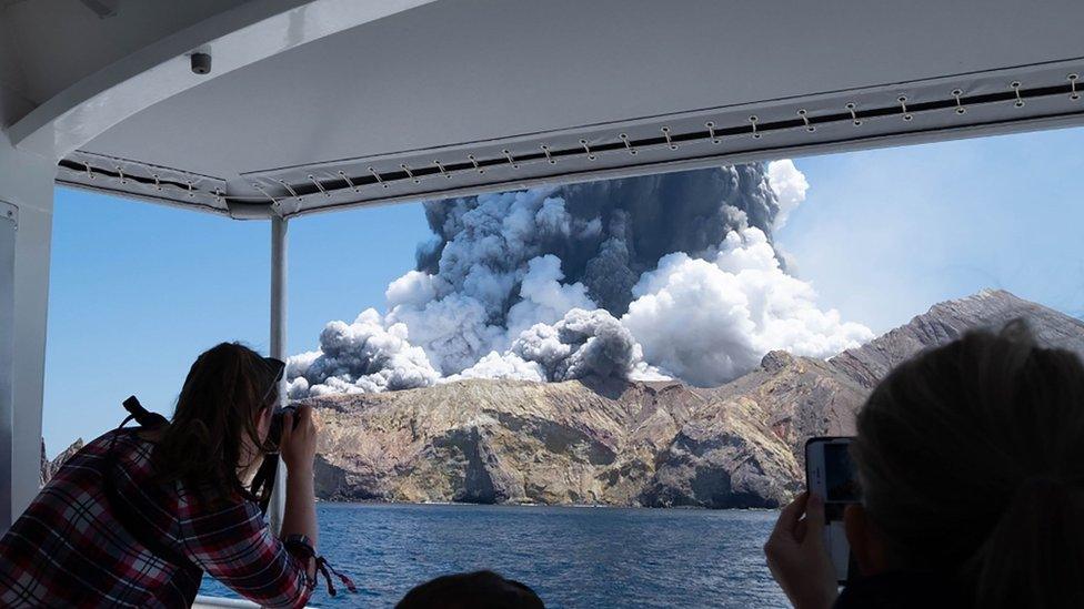 New Zealand's White Island volcano spews steam and ash moments after erupting on 9 December, 2019.