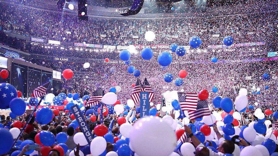 Balloons fall over delegates and attendees at the end of the fourth day of the Democratic National Convention at the Wells Fargo Center