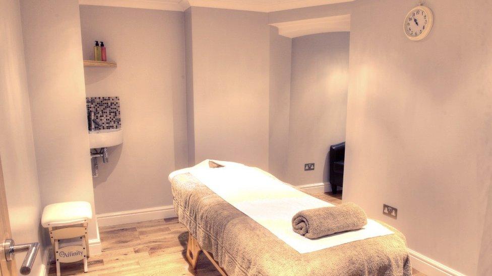 A massage therapy treatment room