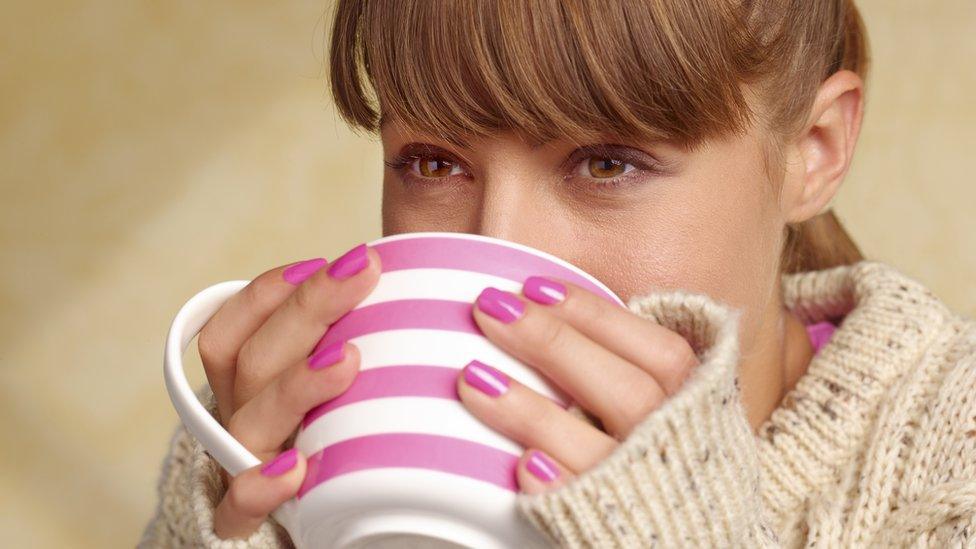 Woman drinking coffee