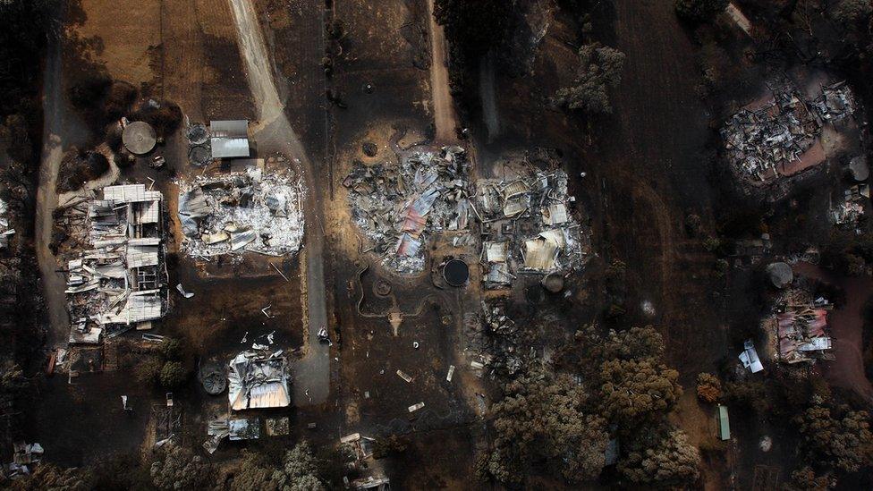 An aerial view of a row of houses in Kinglake shows houses destroyed