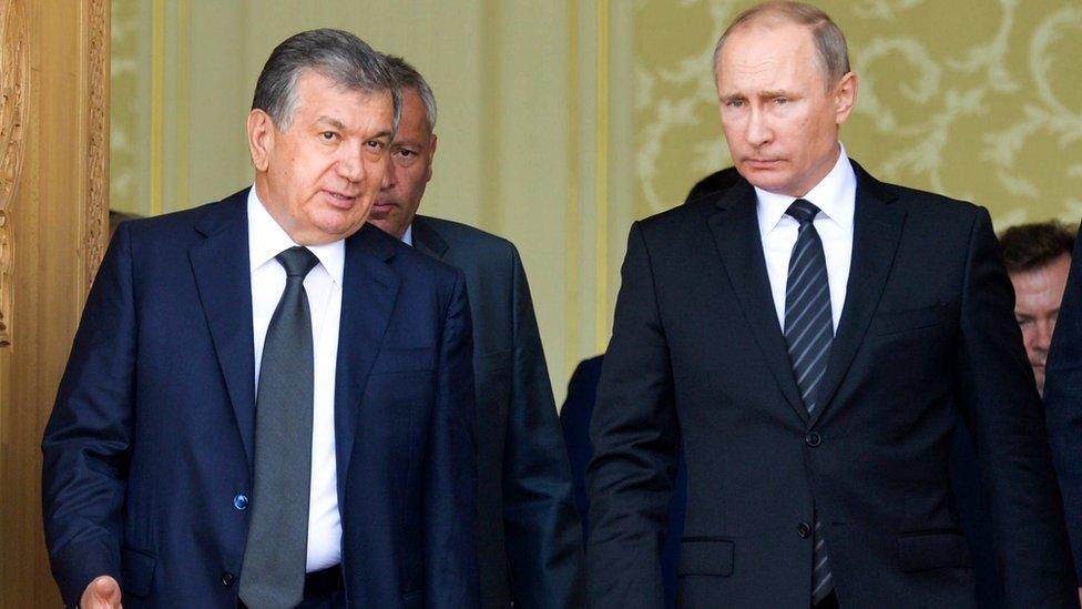 In this file photo taken on Tuesday, Sept. 6, 2016, Uzbekistan"s Prime Minister Shavkat Mirziyoyev, left, speaks with Russian President Vladimir Putin in Samarkand, Uzbekistan, Tuesday, Sept. 6, 2016