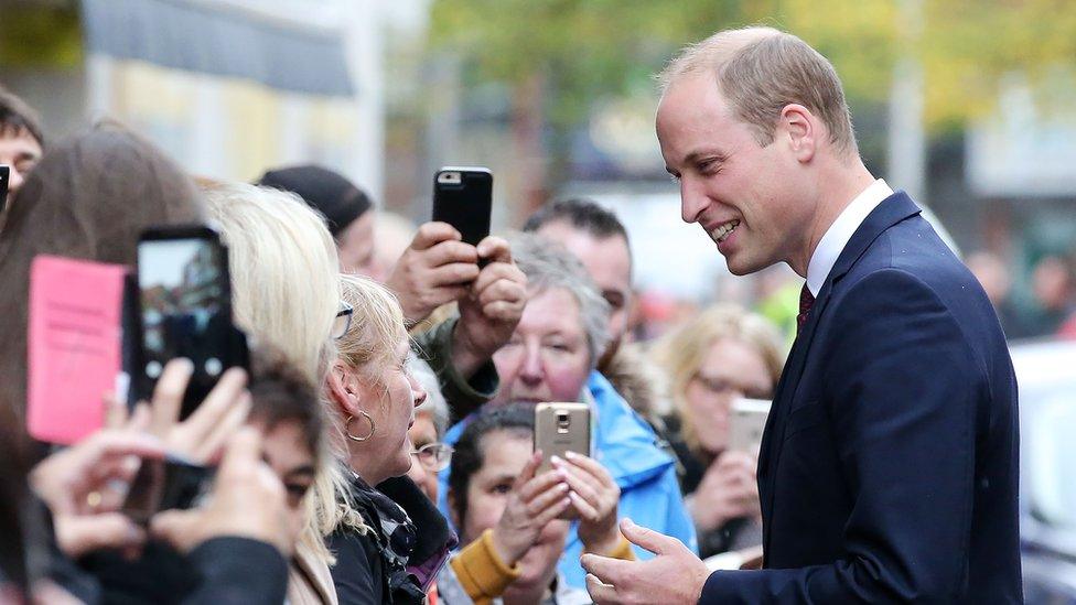 The duke meeting people who had lined the streets in Belfast