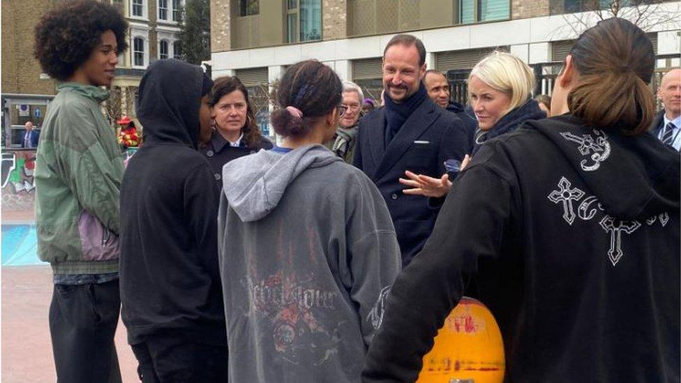 Norwegian prince talks to a group of skateboarders