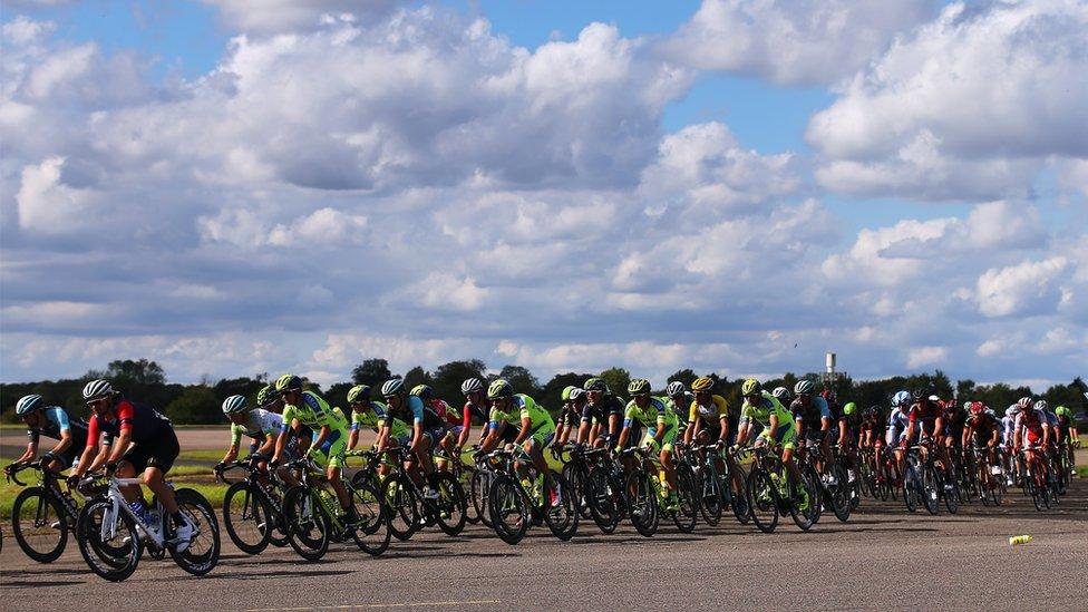 The peloton rides down the runaway at Wattisham Airfield during stage seven of the 2015 Tour of Britain