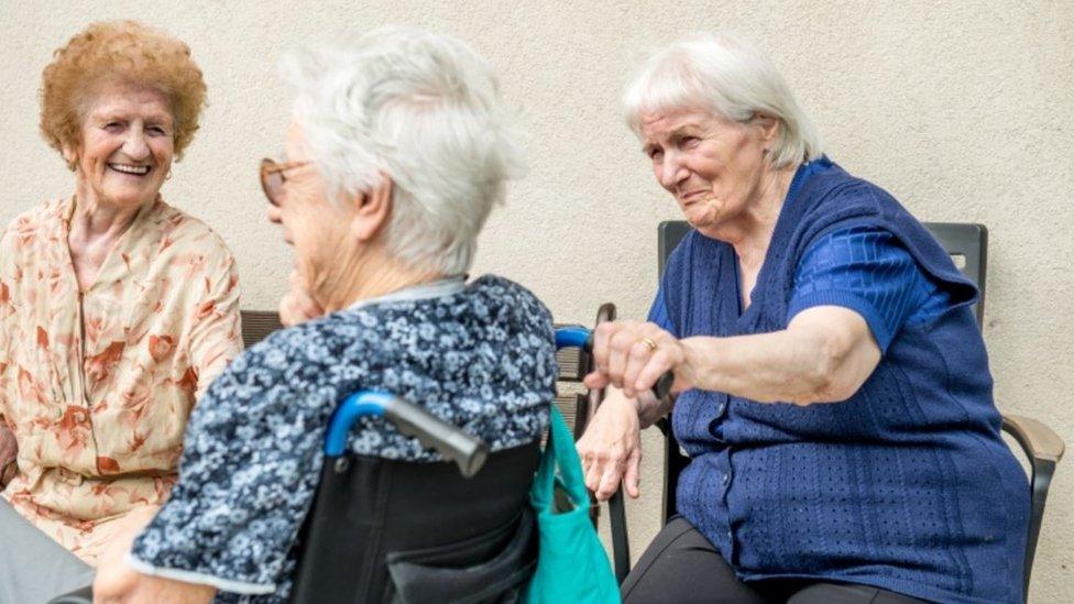 Image of three women laughing