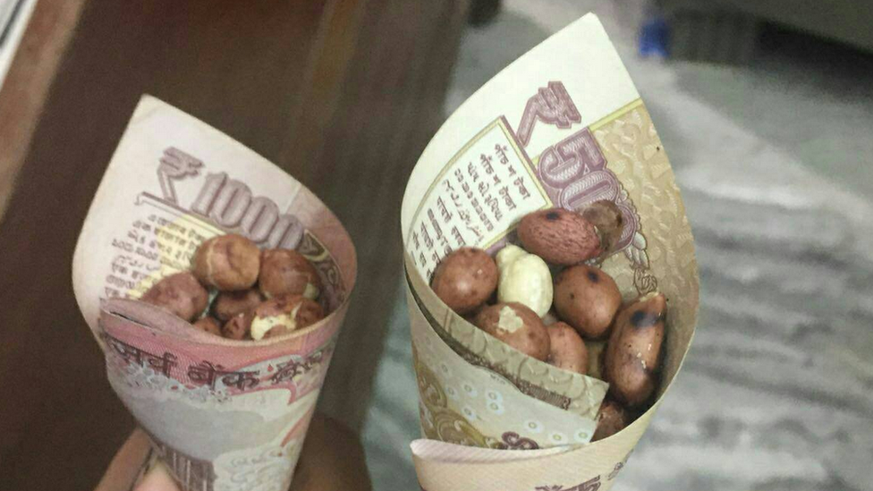 Indian rupees used as snack paper