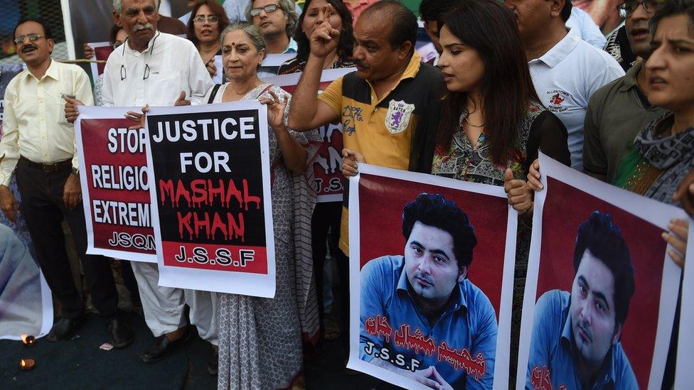 Pakistani protesters with banners demanding justice for Mashal Khan