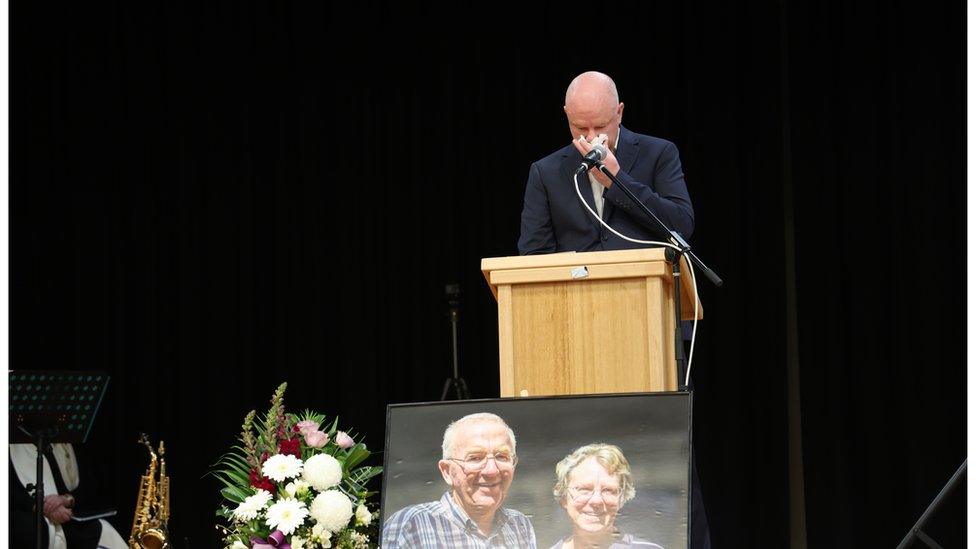 Simon Patterson speaks at a memorial service for his parents