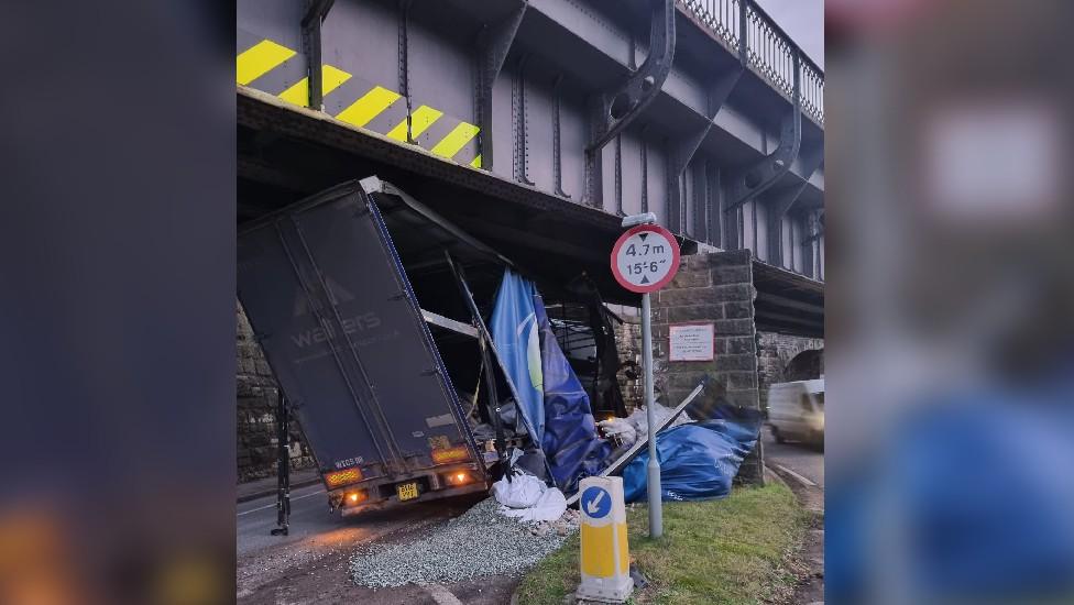 Lorry under bridge