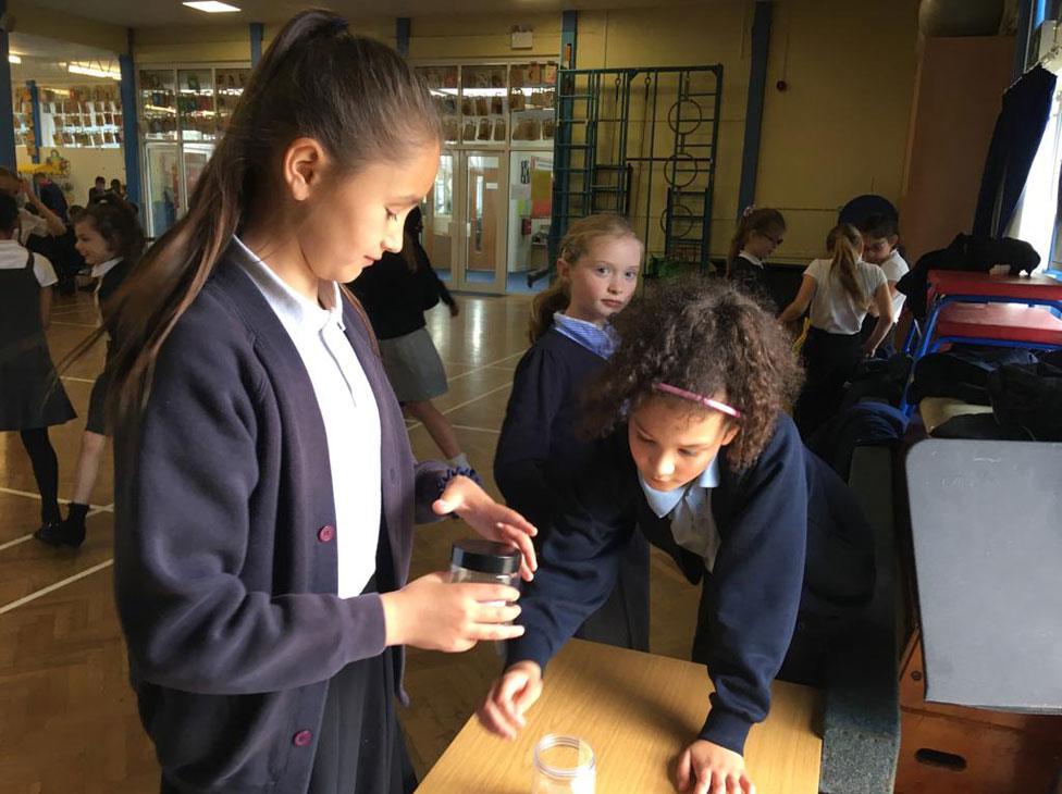 Paying 20p into the lunchtime disco jar