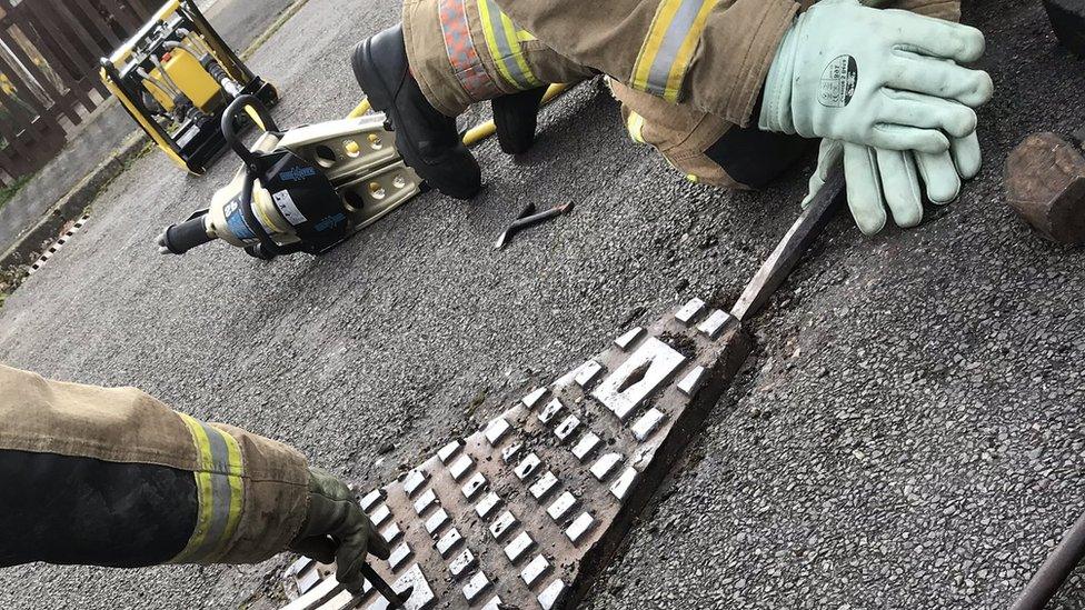 Fire crews removing drain