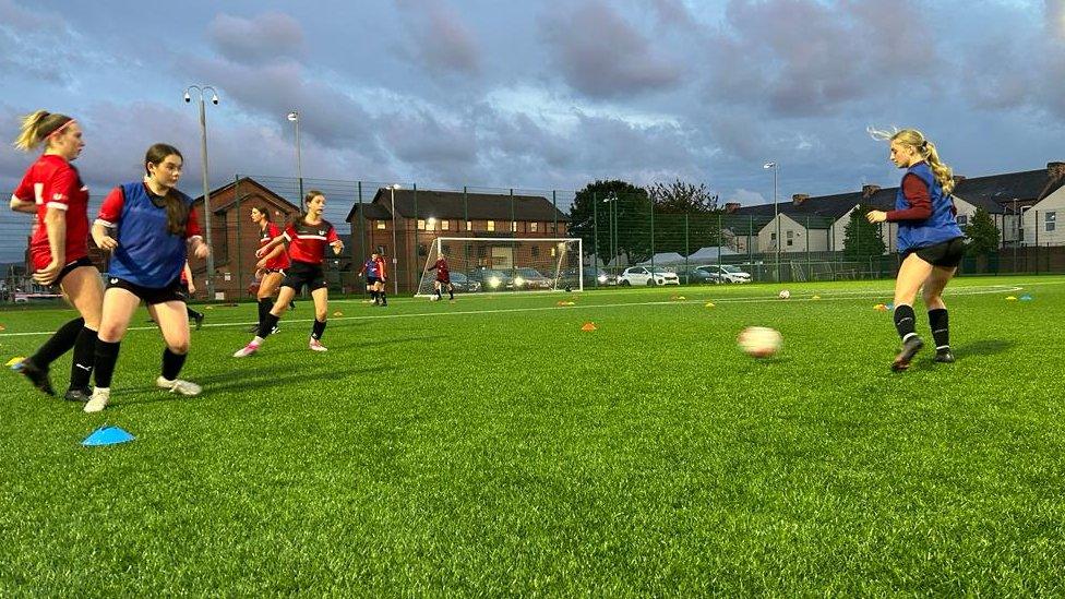 Girls training on the pitch