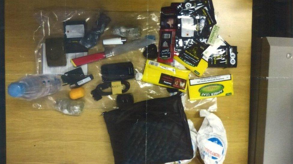 A selection of the banned items found in the cell including tobacco, phone chargers and a bottle