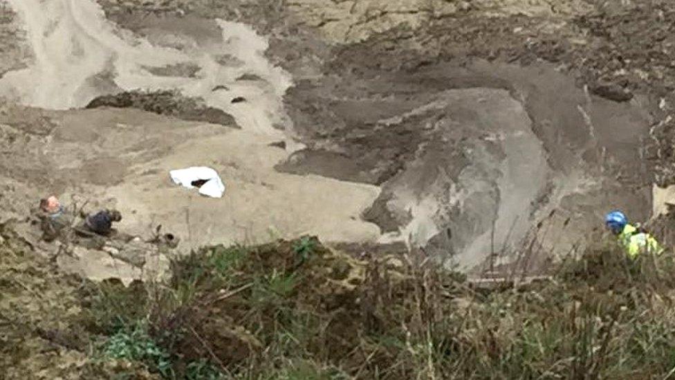 The woman and dog trapped in mud at Trimingham