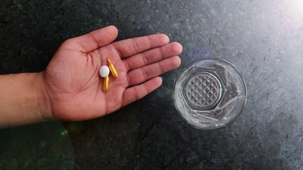 Hand with pills