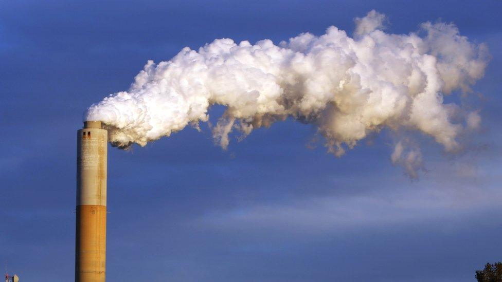 In this Jan. 20, 2015 file photo, steam billows from the chimney or a coal-fired Merrimack Station in Bow, N.H. USA.