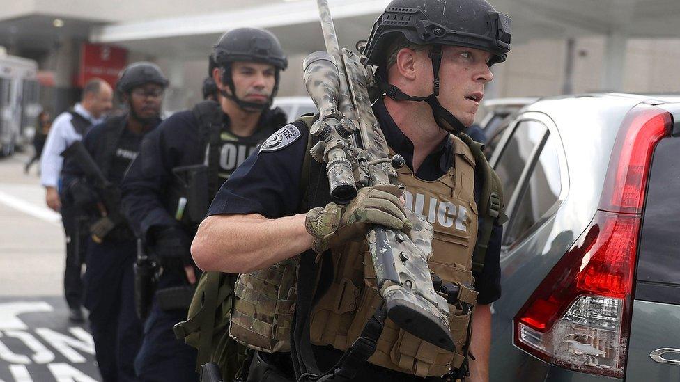 First responders secure the area outside the Fort Lauderdale-Hollywood International airport after a shooting took place near the baggage claim