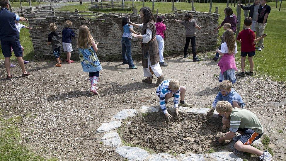 Children play at Castell Henllys