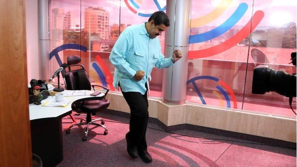 Venezuela's President Nicolas Maduro dances during his radio program at Miraflores Palace in Caracas, Venezuela November 1, 2016.