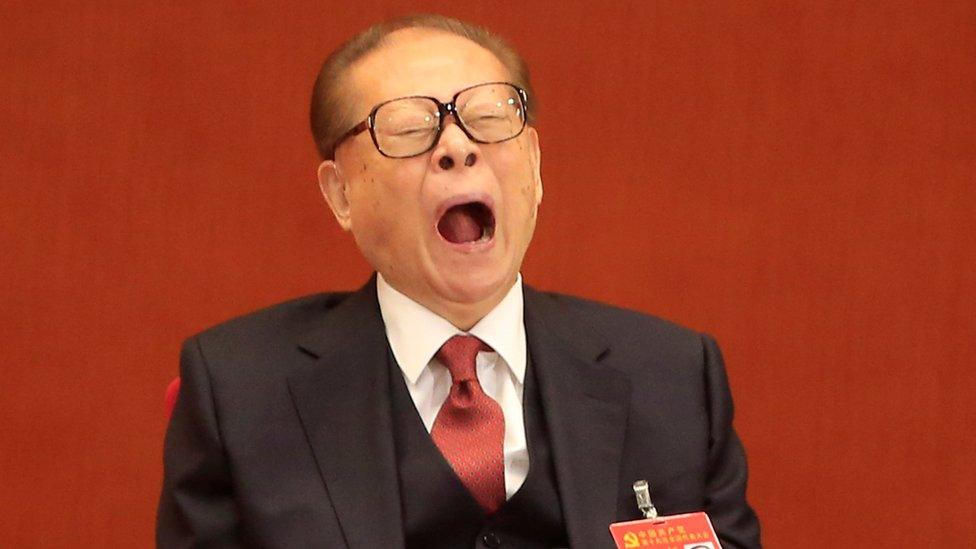 Former Chinese President Jiang Zemin is seen yawning during the opening session of the 19th National Congress of the CPC