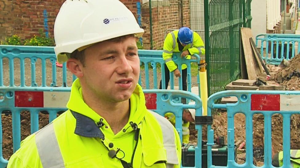 Ewan Bye wearing hard hat and hi-vis jacket