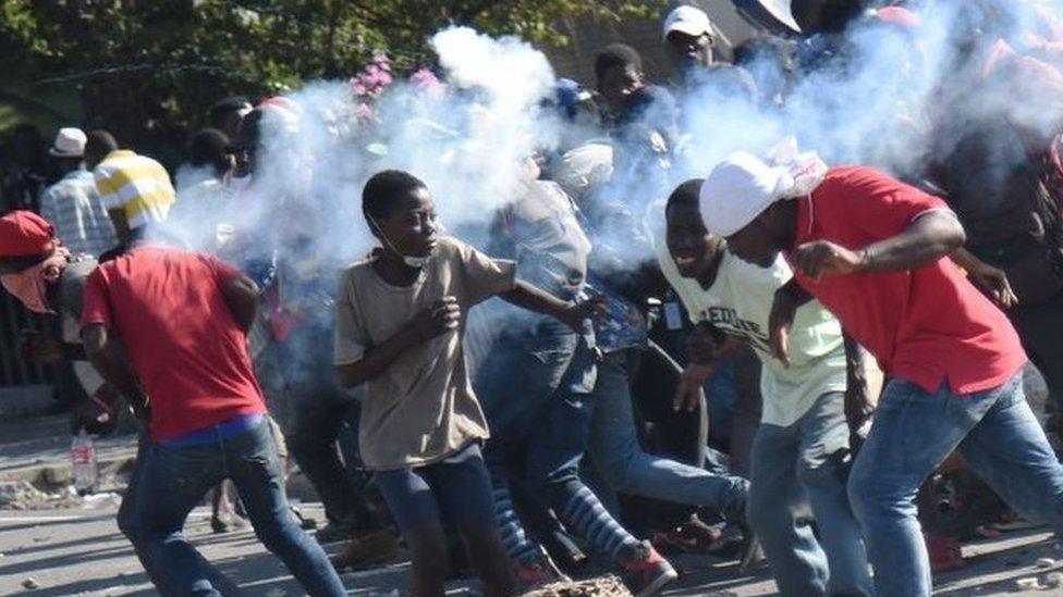 A tear gas canisters hits protesters in Port-au-Prince, Haiti. Photo: 13 February 2019