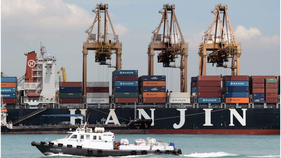 A container ship sits docked at the Keppel terminal container port in Singapore (April 12, 2013)