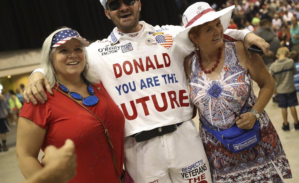 Trump supporters with one T-shirt that says "Donald Trump you are the future"