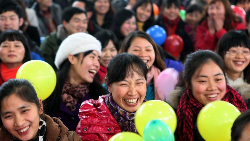 In this picture taken on January 15, 2011, workers gather for a Chinese new year dinner provided by their employer