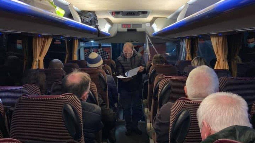 Michael Collins (centre) helped to organise 65 "cataract buses" to Belfast