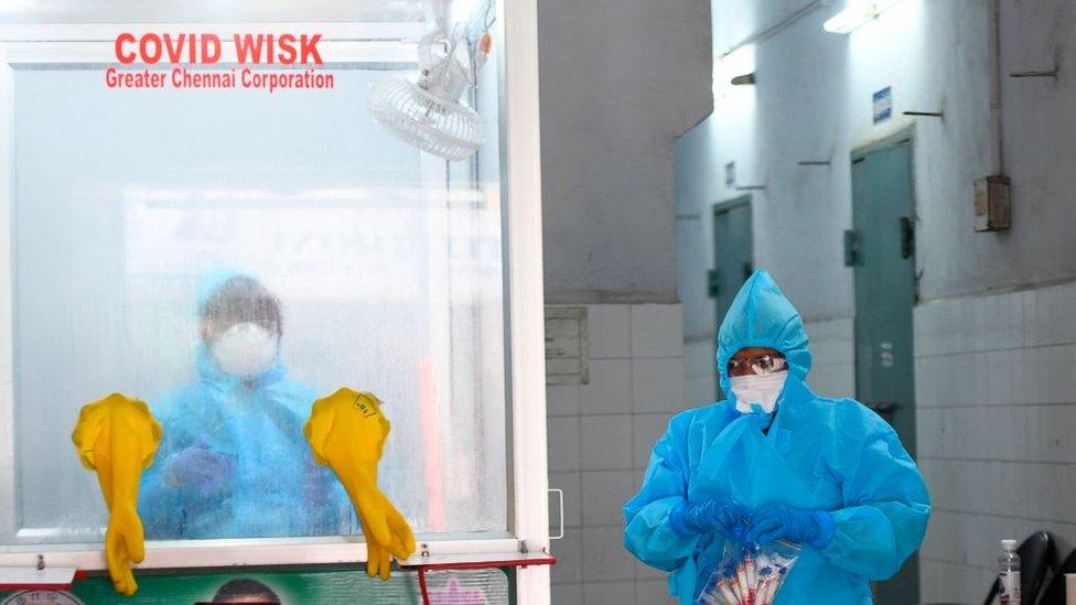 A medical technician packs samples collected from people at a COVID-19 testing and sample collection centre during a government-imposed nationwide lockdown as a preventive measure against the COVID-19 coronavirus in Chennai on April 14, 2020.