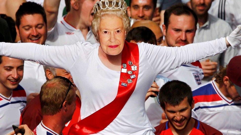 Her Majesty enjoying the atmosphere - but maybe it's a mask?