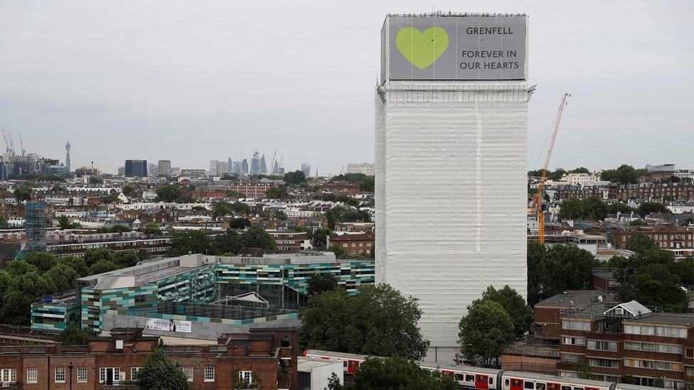 Grenfell Tower is seen shrouded by scaffolding