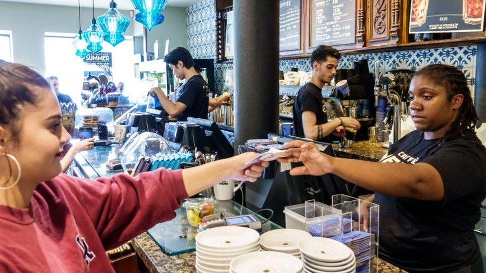 Woman working in coffee bar