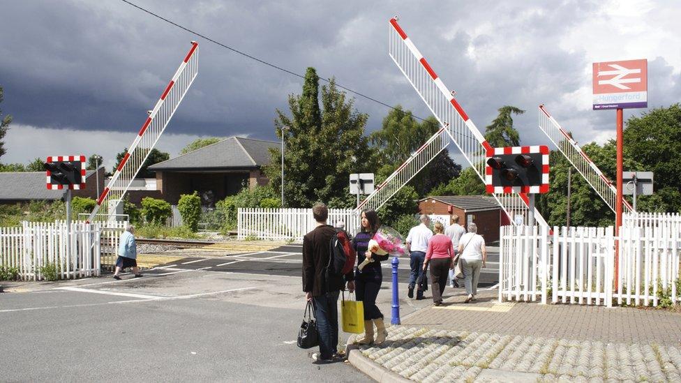 People crossing a level crossing