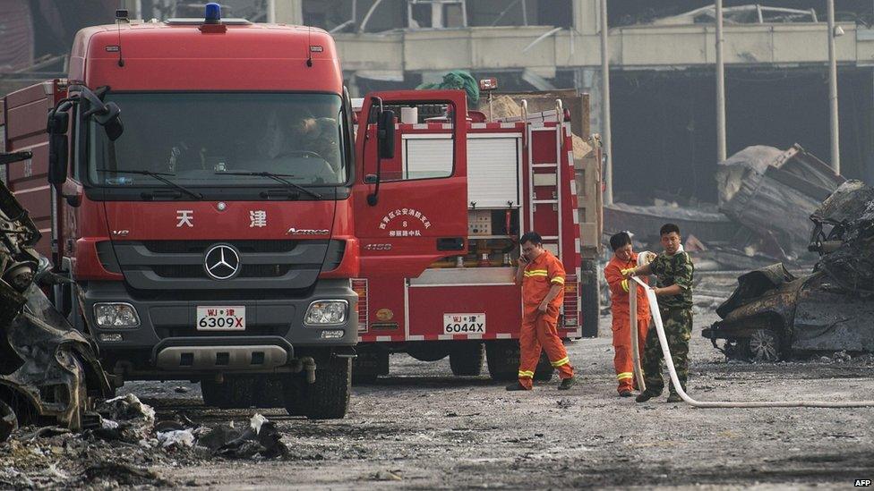 Firemen at the scene of the explosions in Tianjin