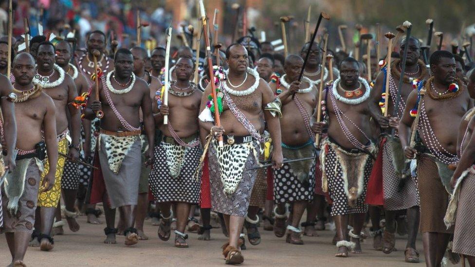 King Mswati III of Swaziland (C) arrives at the annual royal Reed Dance at the Ludzidzini Royal palace on August 28, 2016 in Lobamba, Swaziland