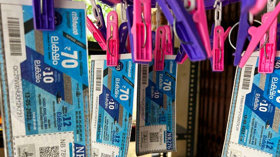 Lottery tickets hang at a store