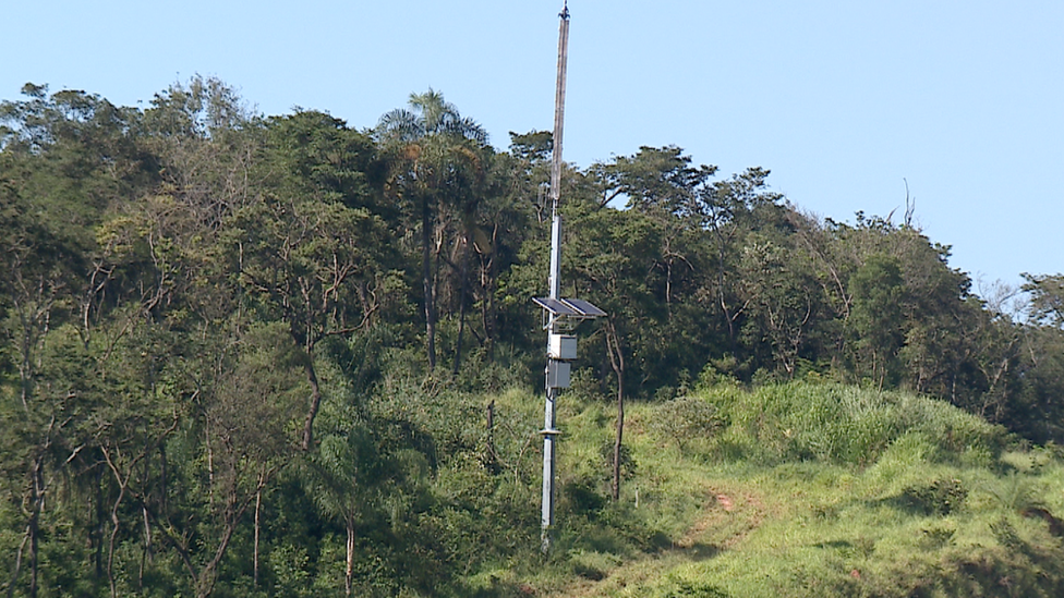 A mast with a warning siren attached