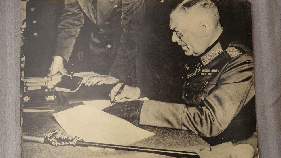 Field-Marshal Keitel signing the surrender for the German Army