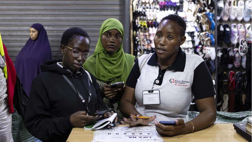 Kenya Revenue Authority (KRA) tax agents visit a business in the Eastleigh district of Nairobi, Kenya, on Thursday, Oct. 19, 2023. Deploying 1,400 tax collectors is the most aggressive in a long line of controversial steps by President William Ruto to nearly double the government's revenue collection to a quarter of gross domestic product by 2030