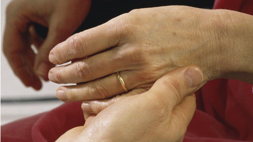 Stock picture of a nurse comforting a patient